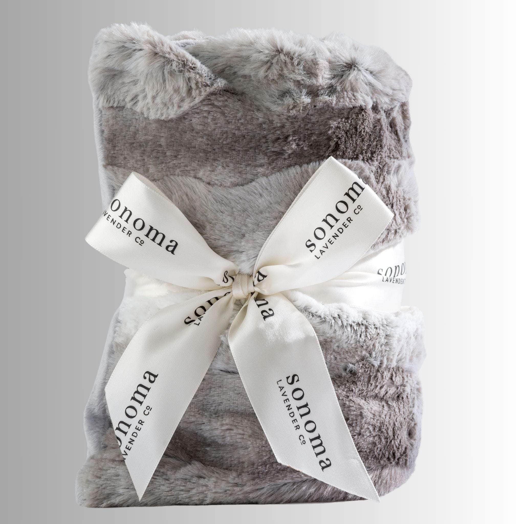 Lavender heat wrap for neck and shoulders, made with soft plush fabric and filled with calming lavender and flaxseed for soothing warmth and relaxation.