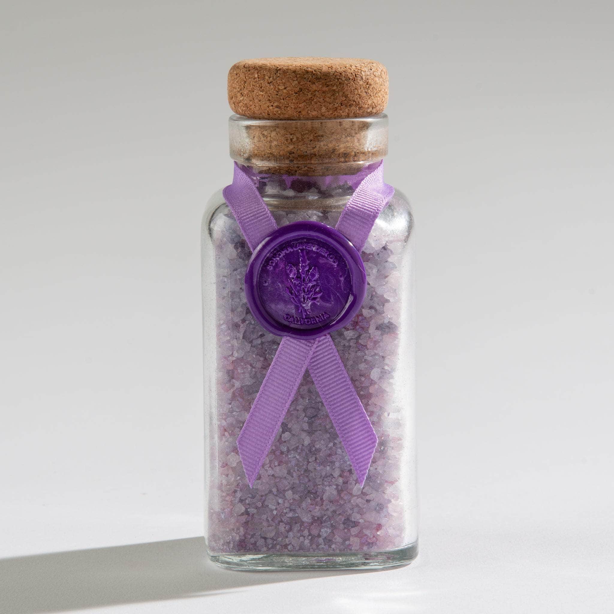 Transform your bath into a relaxing spa retreat with our Lavender Bath Salts in a beautiful glass jar with cork. Infused with calming lavender, these salts soothe muscles, promote relaxation, and enhance your self-care ritual.