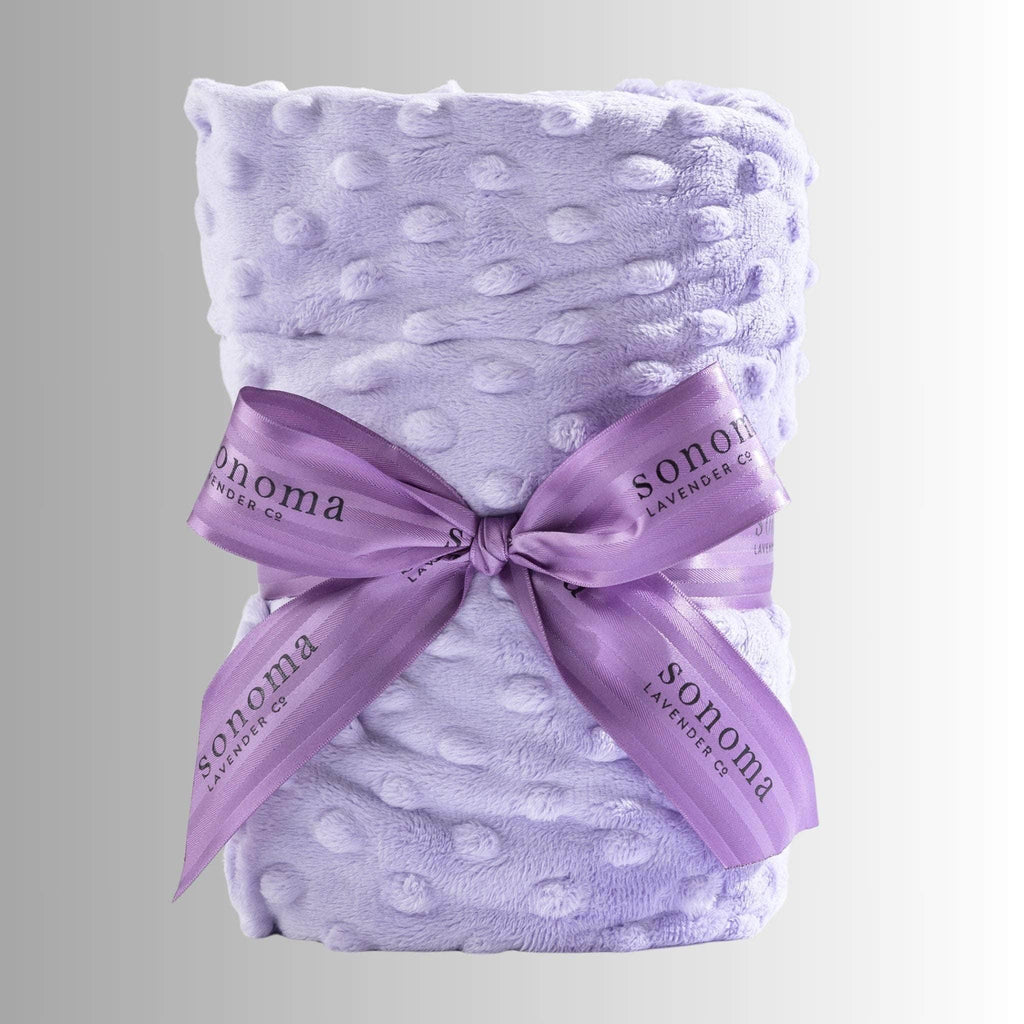 Lavender heat wrap for neck and shoulders, made with soft plush fabric and filled with calming lavender and flaxseed for soothing warmth and relaxation.