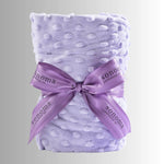 Lavender heat wrap for neck and shoulders, made with soft plush fabric and filled with calming lavender and flaxseed for soothing warmth and relaxation.