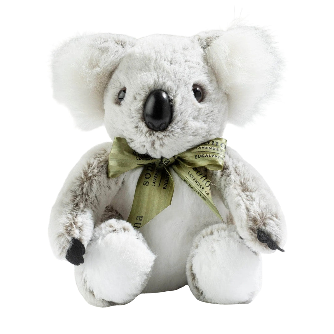 A heated stuffed white koala toy with a green ribbon | eucalyptus products​ | Sonoma Lavender