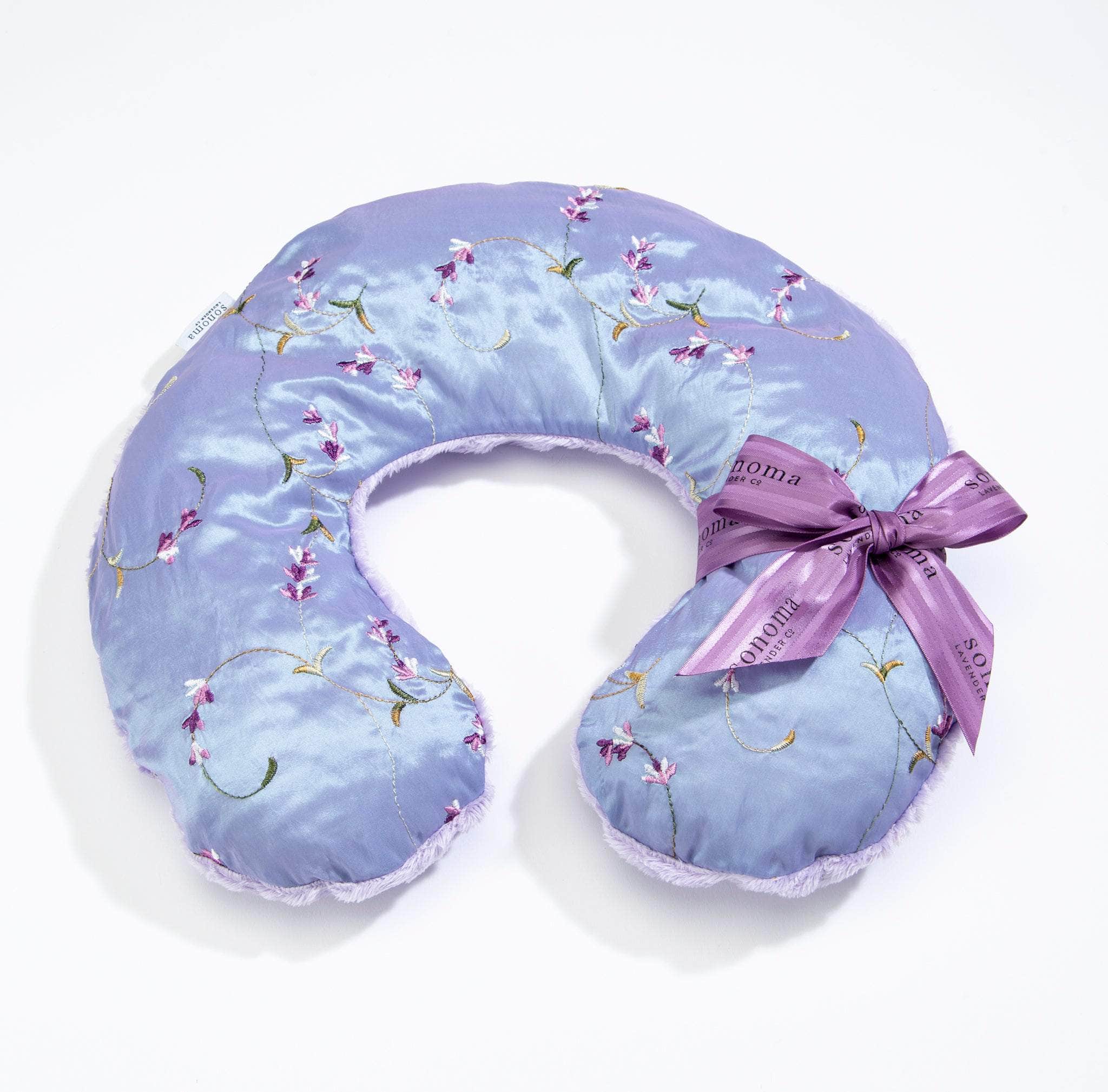 Relax and unwind with the Lavender Spa Neck Pillow, featuring soothing lavender scent and soft embroidered lilac for ultimate comfort and stress relief.