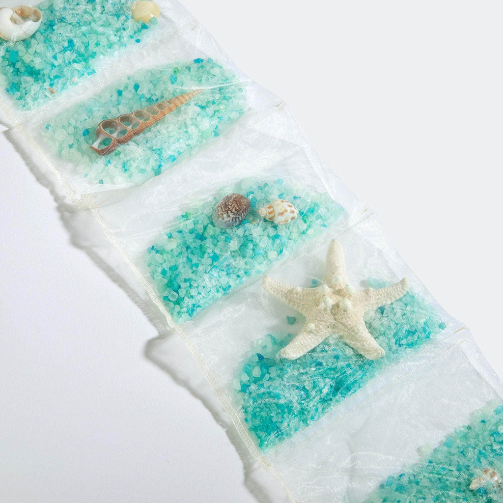 Ocean Aire Scented Sachet-by-the-Yard with Seashells—infuse your space with the refreshing scent of the sea while adding a coastal touch to drawers, closets, and linens.